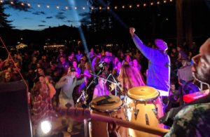 Band playing on stage and dancing