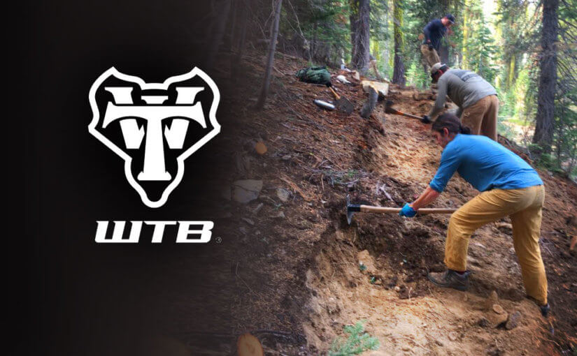 WTB logo and workers on trail
