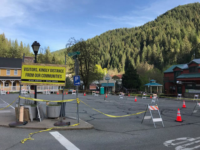 Downtown Downieville sign: Visitors, kindly distance from our communities