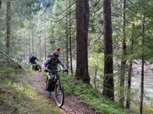 Trailcrew riding Santa Cruz Hecklers to Third Divide for work