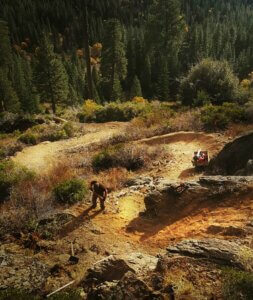 Trail worker digging trail.