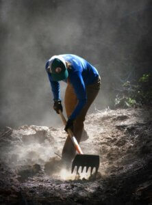 Trail worker digging