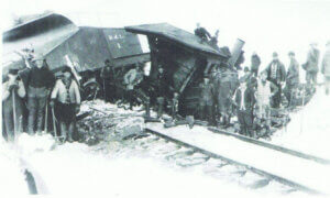 A Boca and Loyalton Locomotive sits across the tracks after this winter accident, circa 1905. Note the bucker plow (B&L No. 1) on the left, designed to push light snow off the tracks. (Loyalton Museum collection)