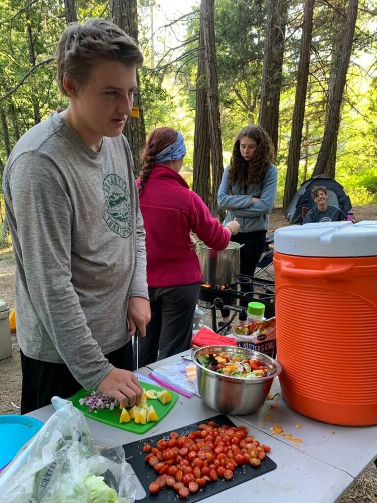 Youth Trail Crew making dinner
