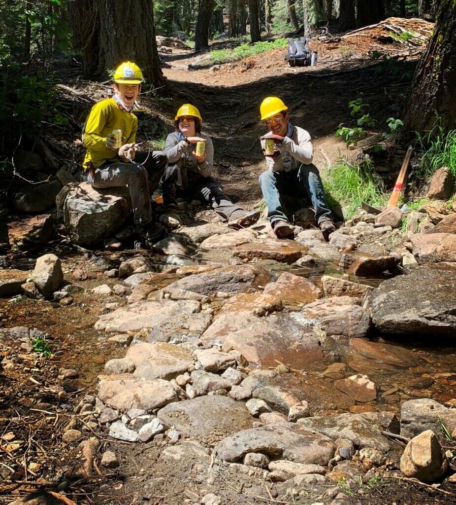 Youth Trail Crew next to creek