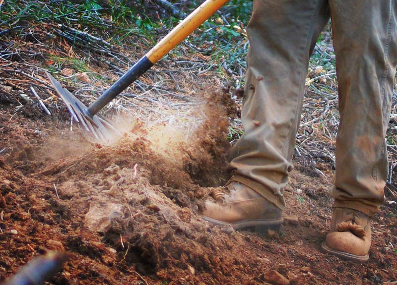 Trail tool diggin dirt