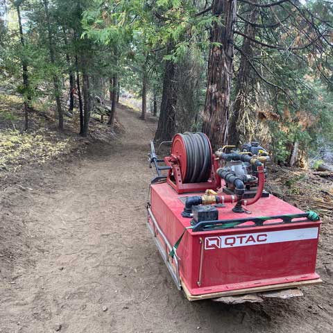 QTAC fire suppression unit on new trail in the forest.